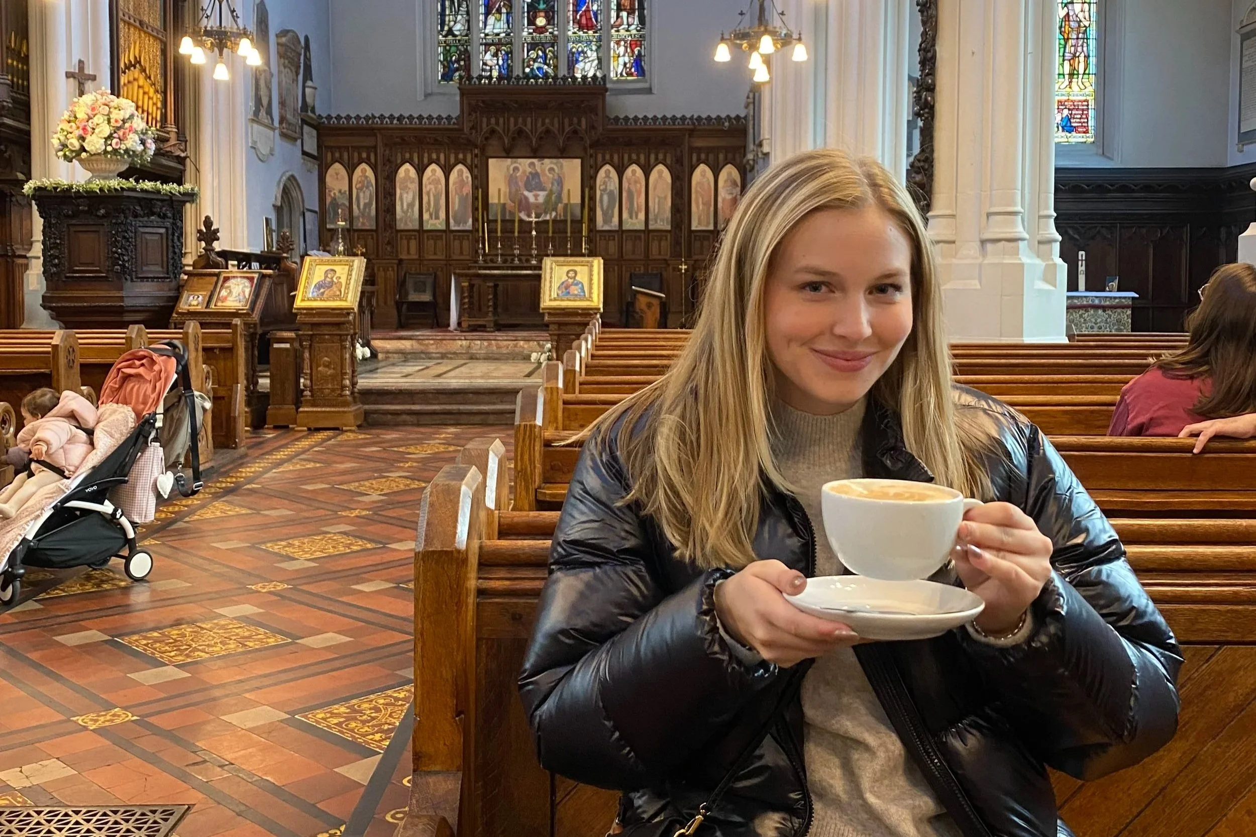 Rachel Robinson enjoying tea inside a historic British church on the Supper Atlas British Isles Two-Week Itinerary