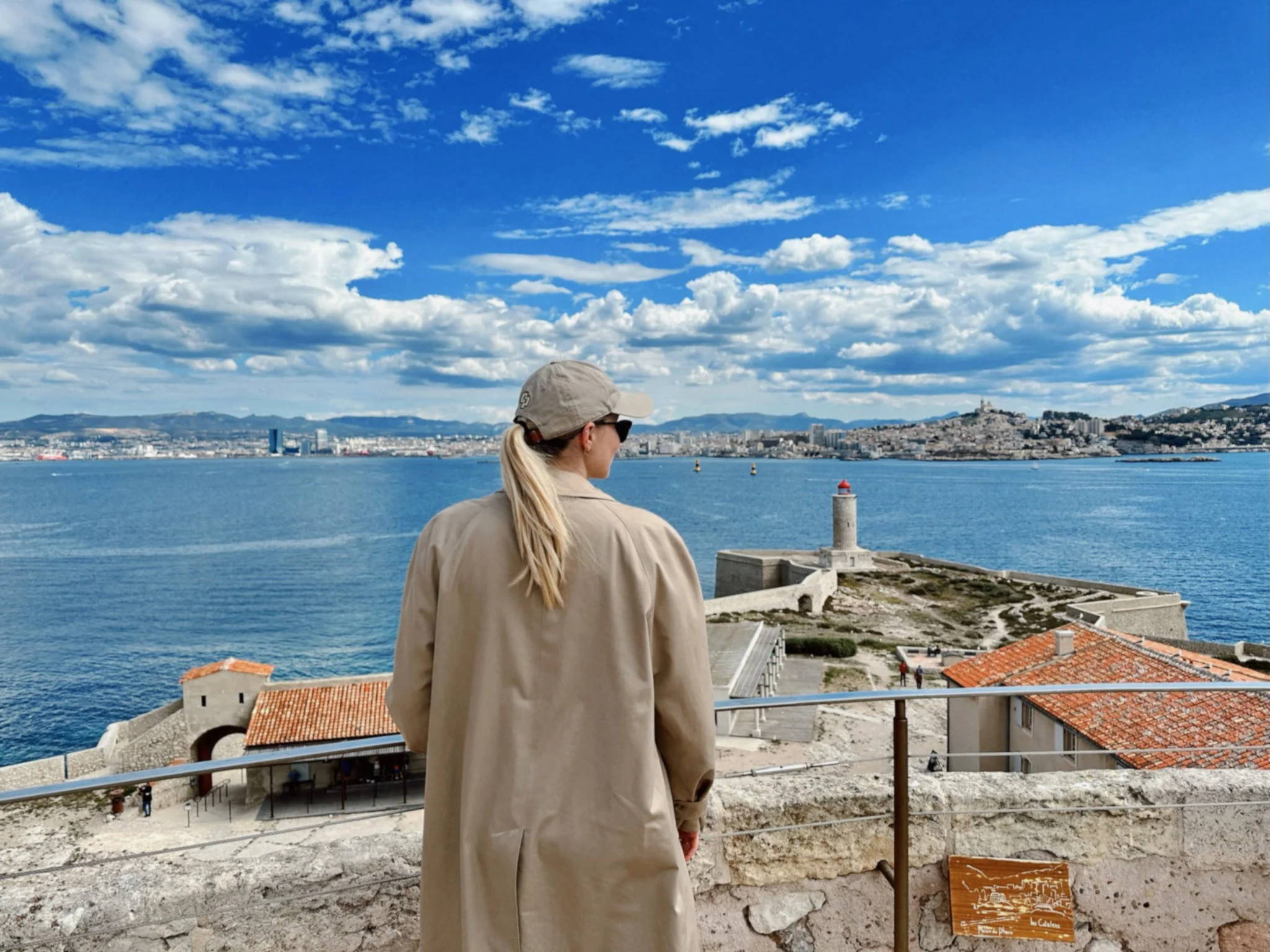 Rachel Robinson overlooking the blue Mediterranean coast and historic fortress in the South of France, Supper Atlas Two-Week Itinerary