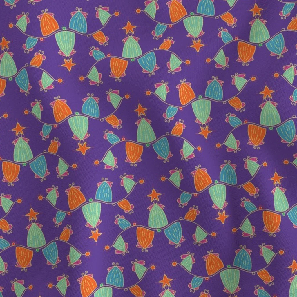 Fabric with a deep purple background with wavy lines of Christmas trees with wings to represent fireflies, with stars on top. Colors include orange, green light blue, yellow, and red.
