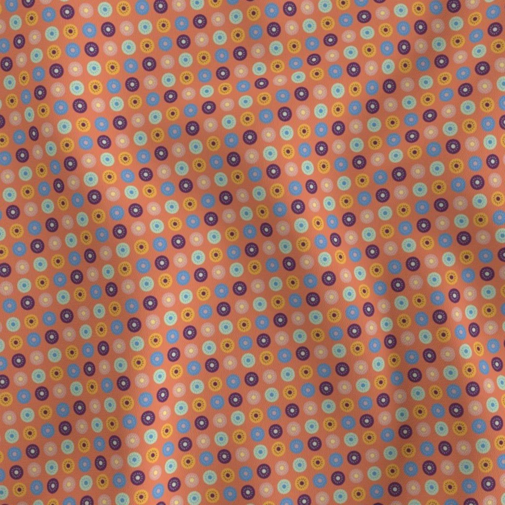 Small Circles in a repeating pattern of various vintage colors with smaller circles with lines shining out from the inner circle. Colors are muted yellow, green, blue, purple, orange, and pink