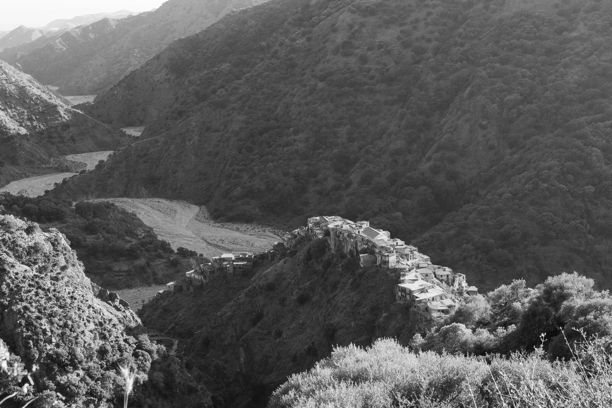 The ghost town of Roghudi stands on a ridge that bisects the passage of the Amendolea River. The village was abandoned in the early 1970s, due to copious and violent floods that damaged it and led the local government of the time to decide to evacuat