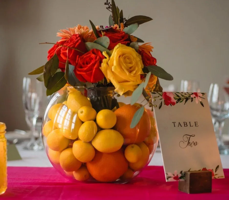 Fresh, vibrant, and full of life; this stunning centerpiece transports your guests right to the Amalfi Coast. 2026 summer weddings are all about bold colors, sun-inspired shades, and uplifting vibes. Our team is here to help you develop an unforgetta