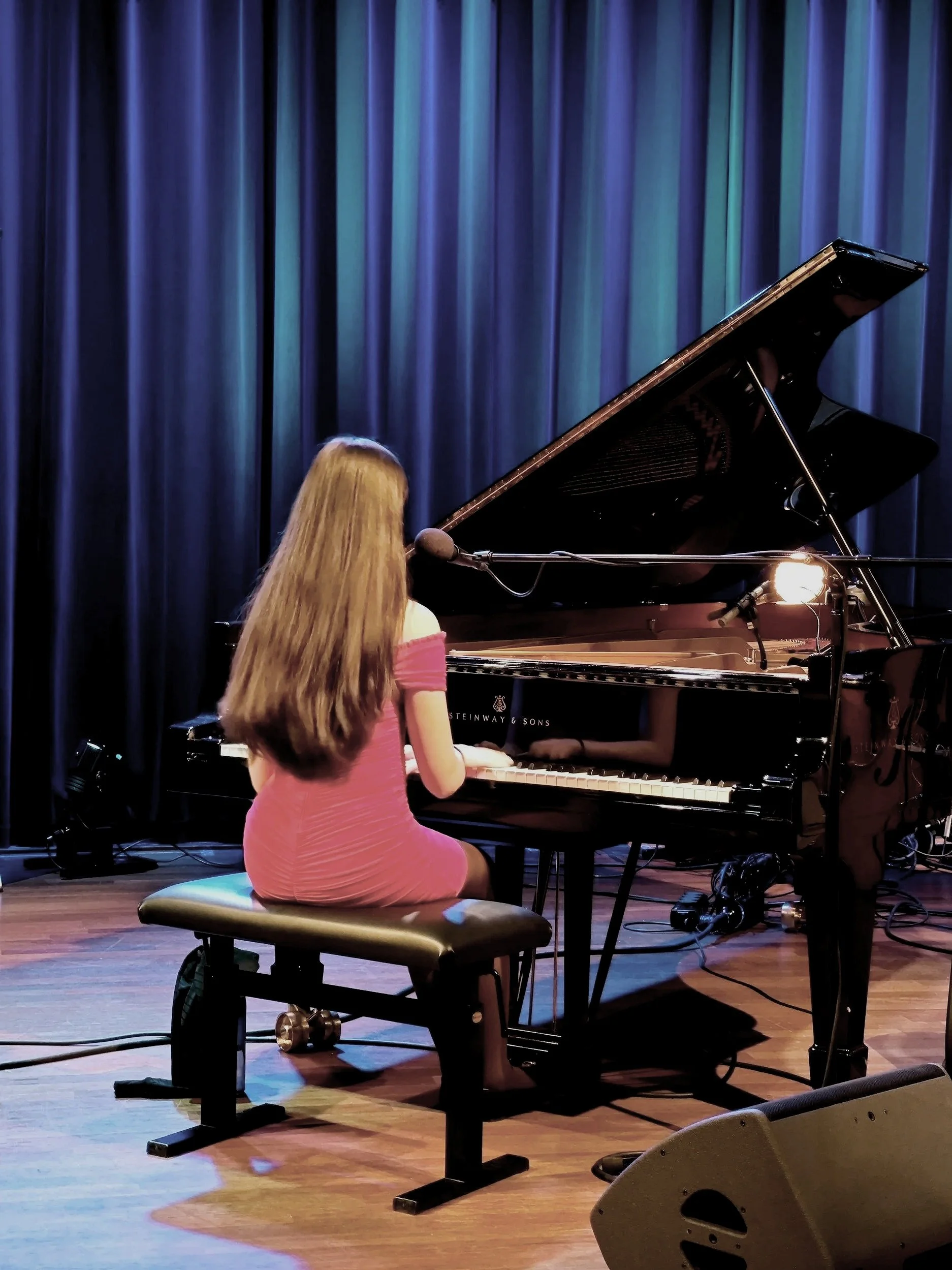 Daughter of local parent's performance on stage at Hashtag music school