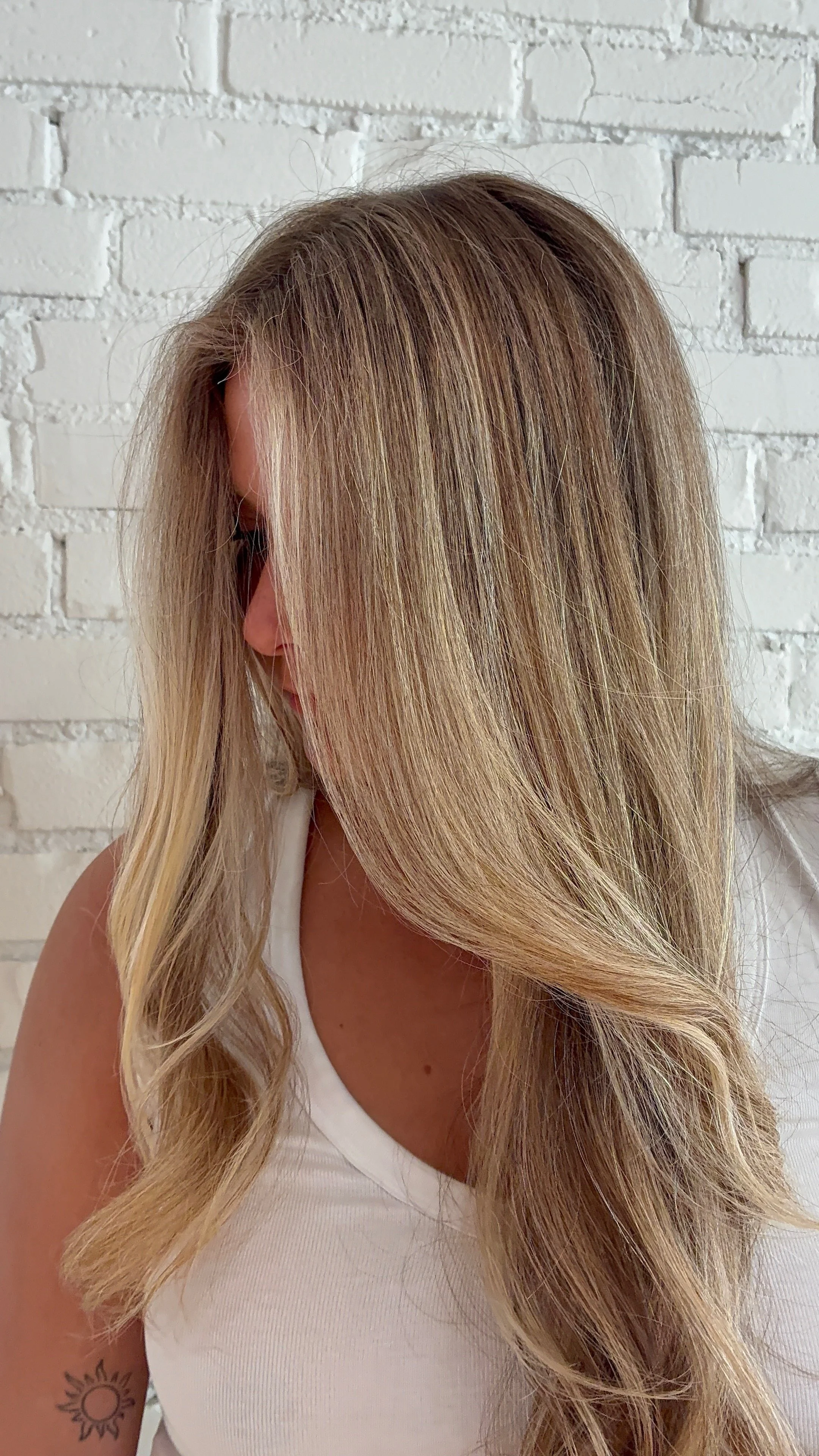 Side view of a girl with blonde hair.