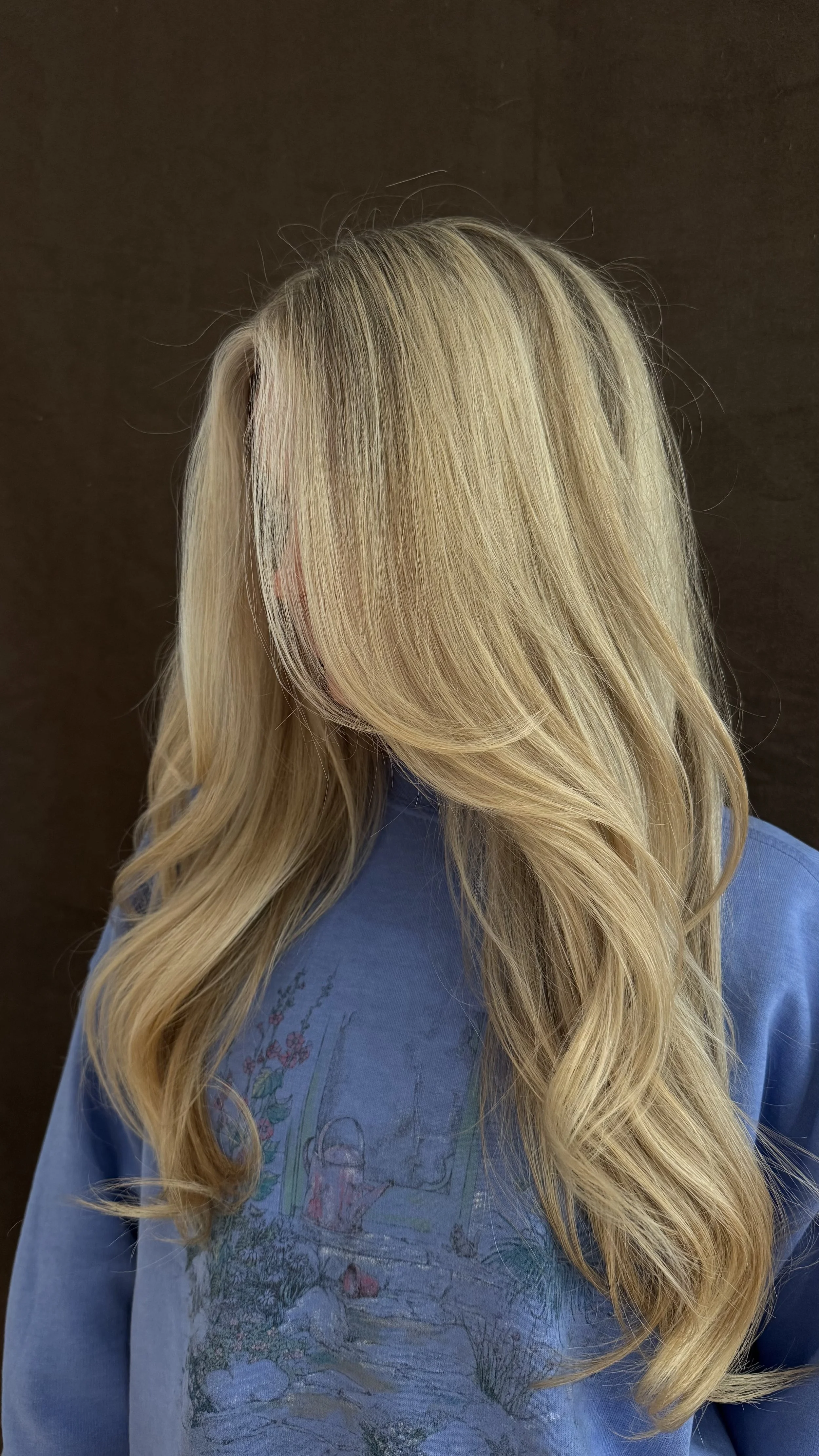Side view of girl with blonde hair.