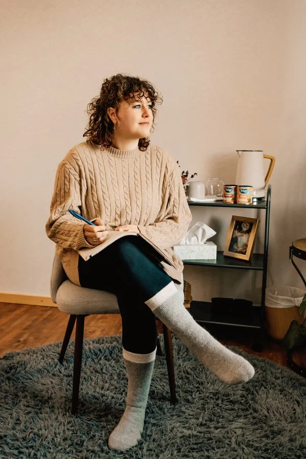 mental health counselor sitting in chair