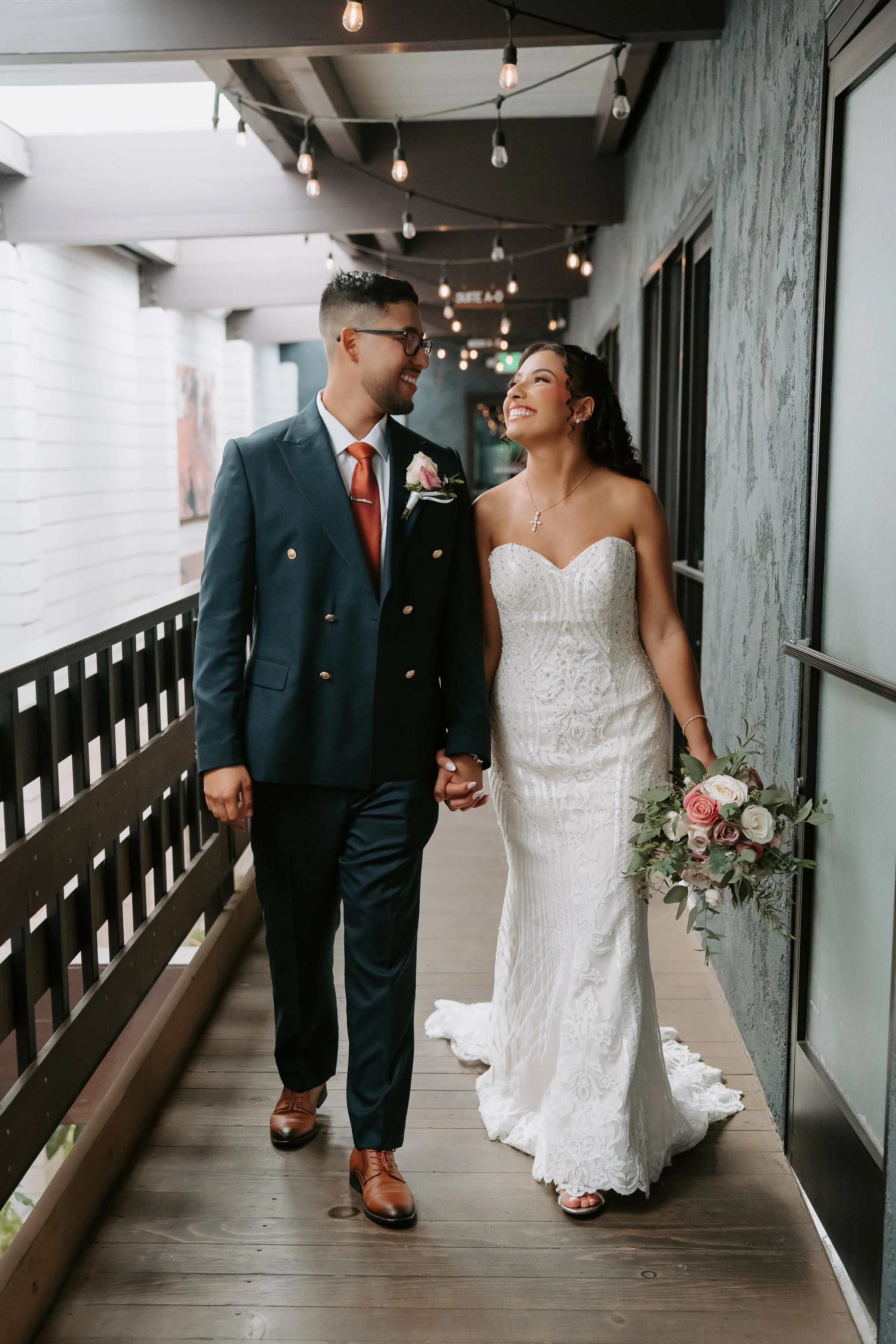 Couple sharing a joyful moment during their wedding at The Century, Downtown Modesto.