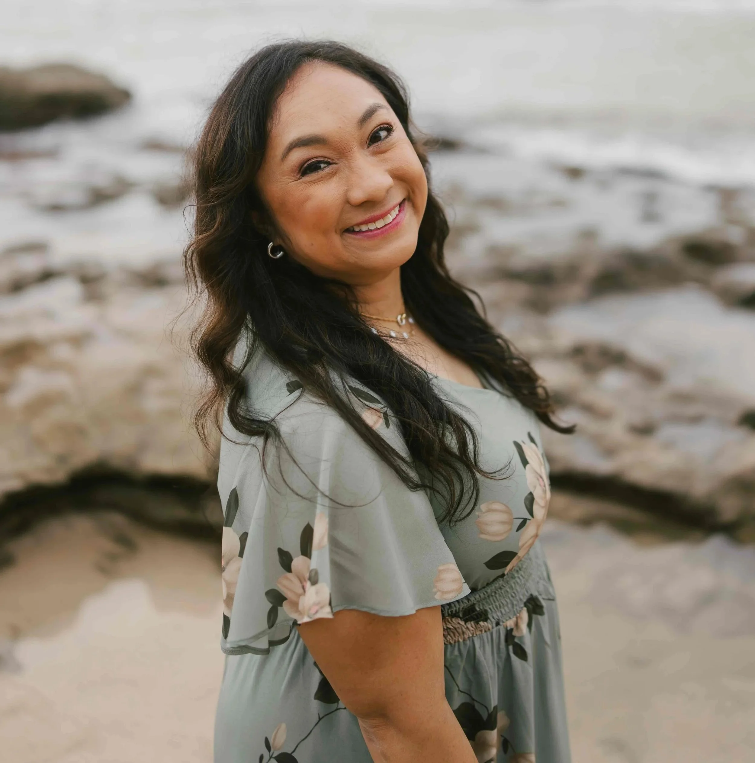 an image of Reba Machado smiling at the camera