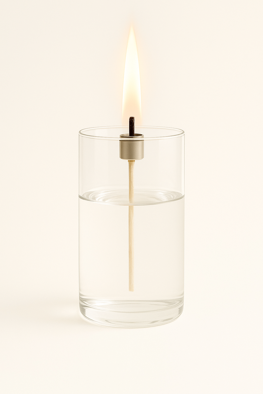 A single white candle burns inside a clear glass holder.The small flame glows steadily, symbolizing spiritual readiness, watchfulness, and the call to be prepared for the return of Jesus—even in the midnight hour.