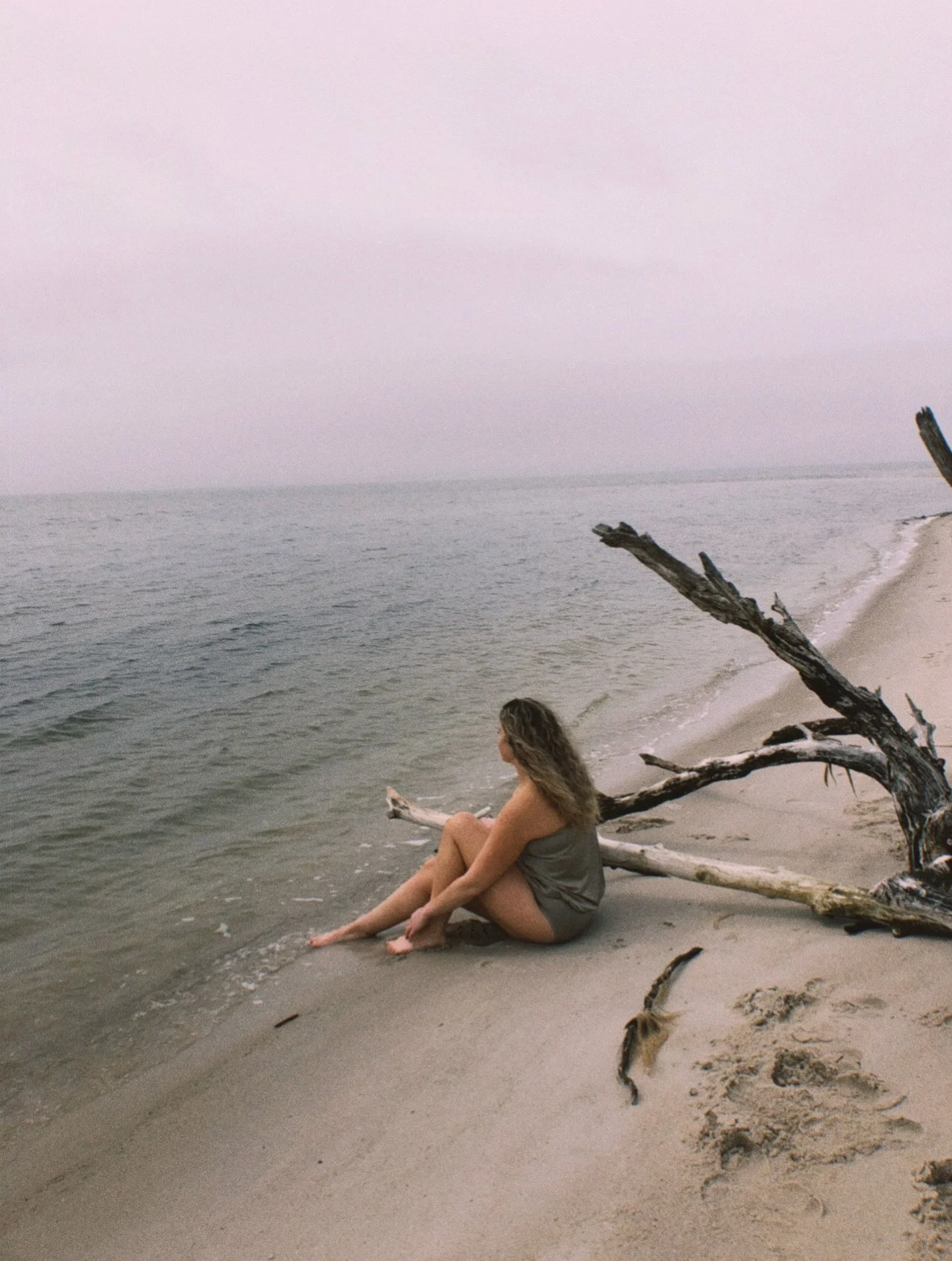 I didn&rsquo;t know it then,
the ripple this would create.
A tidal wave that swallowed the life I once knew,
my imagined future washed away by fate.

Sometimes I barely recognize that girl
sitting there on the shore,
staring out at a life she couldn&