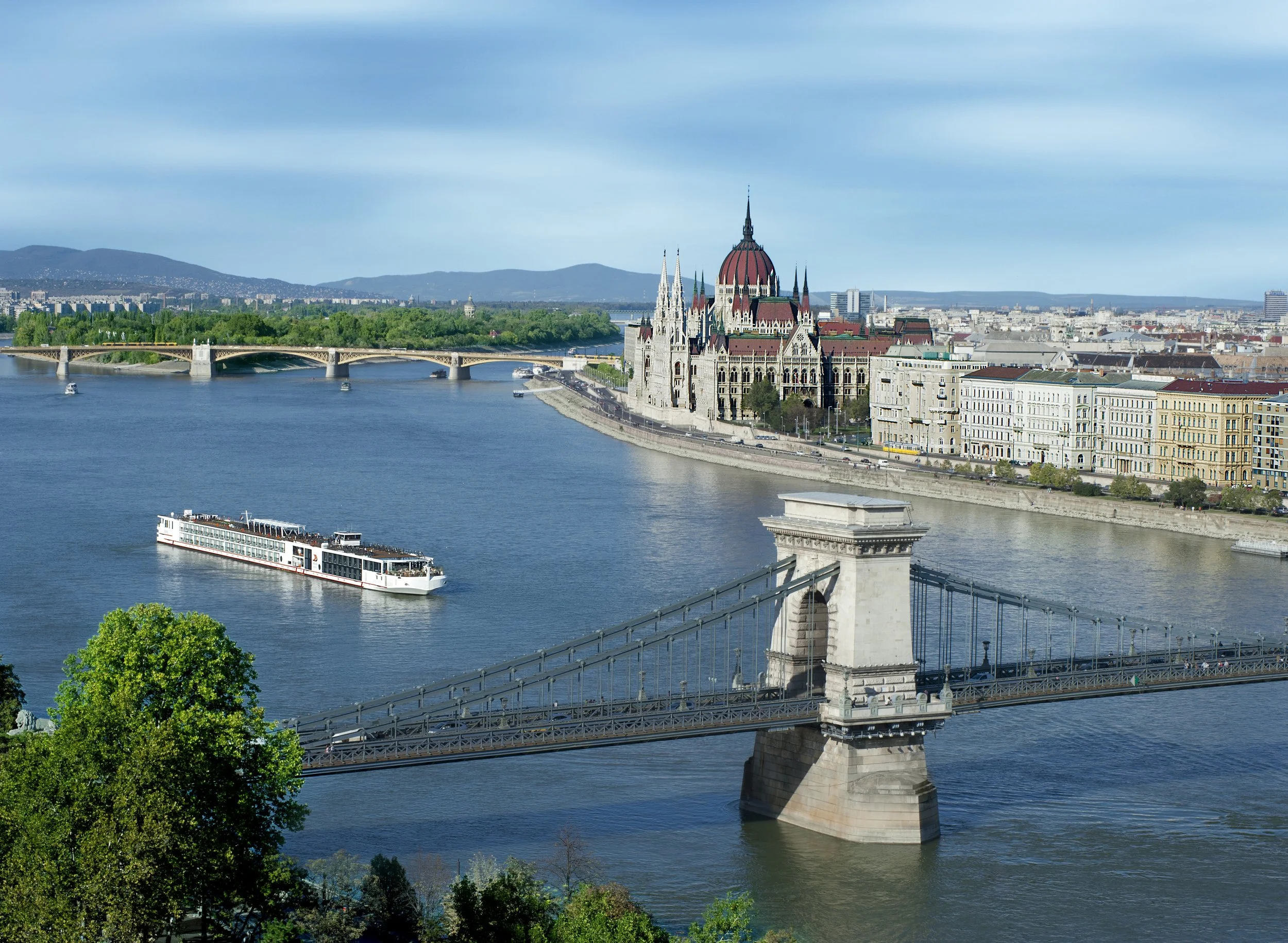 View of the Chain Bridge over the Danube River with the Hungarian Parliament Building in Budapest.