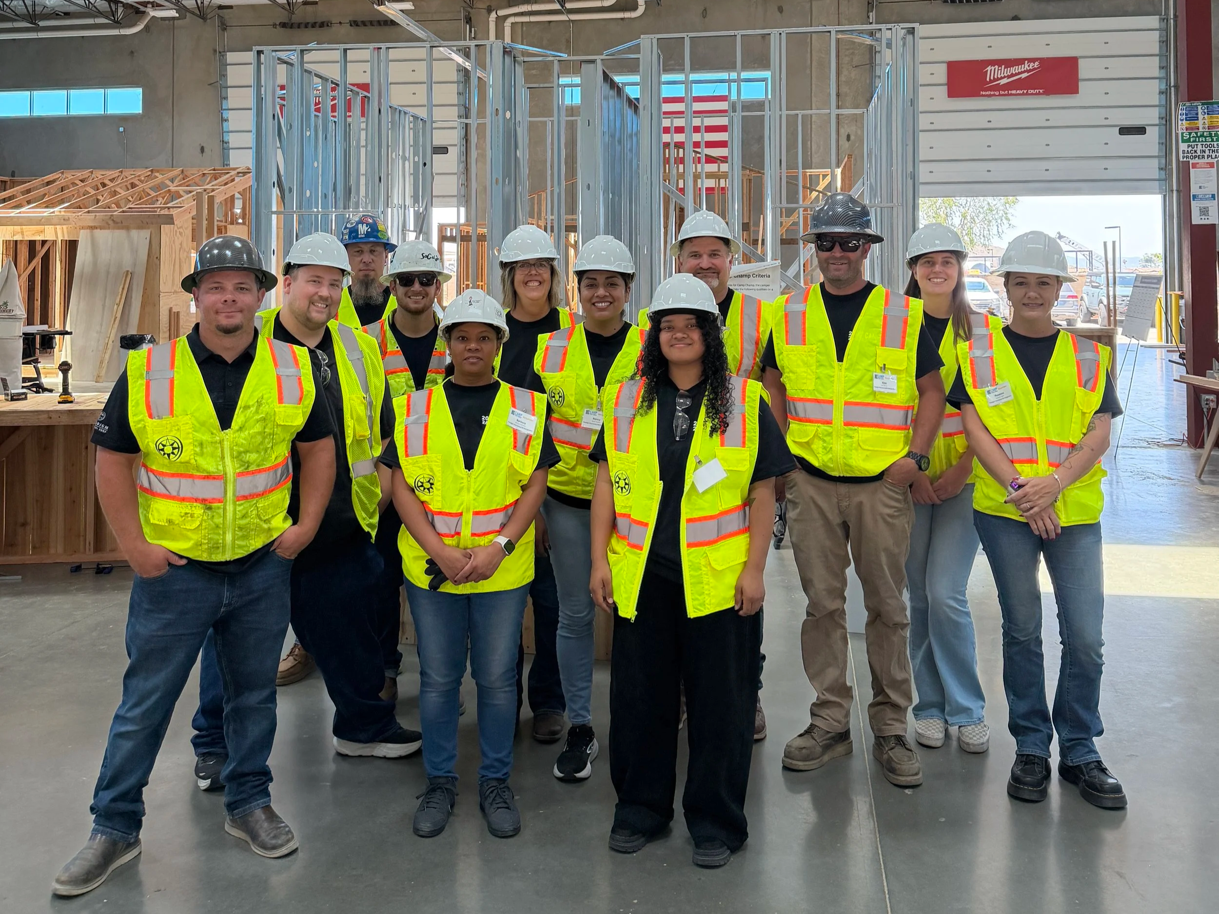 Group of Paradigm Mechanical and San Diego Refrigeration employees in PPE at FCL Camp.