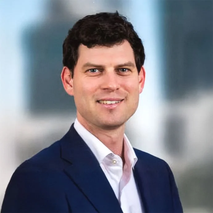 Ben O’Brien, Head of Partnerships at Lighthouse, smiling outside.