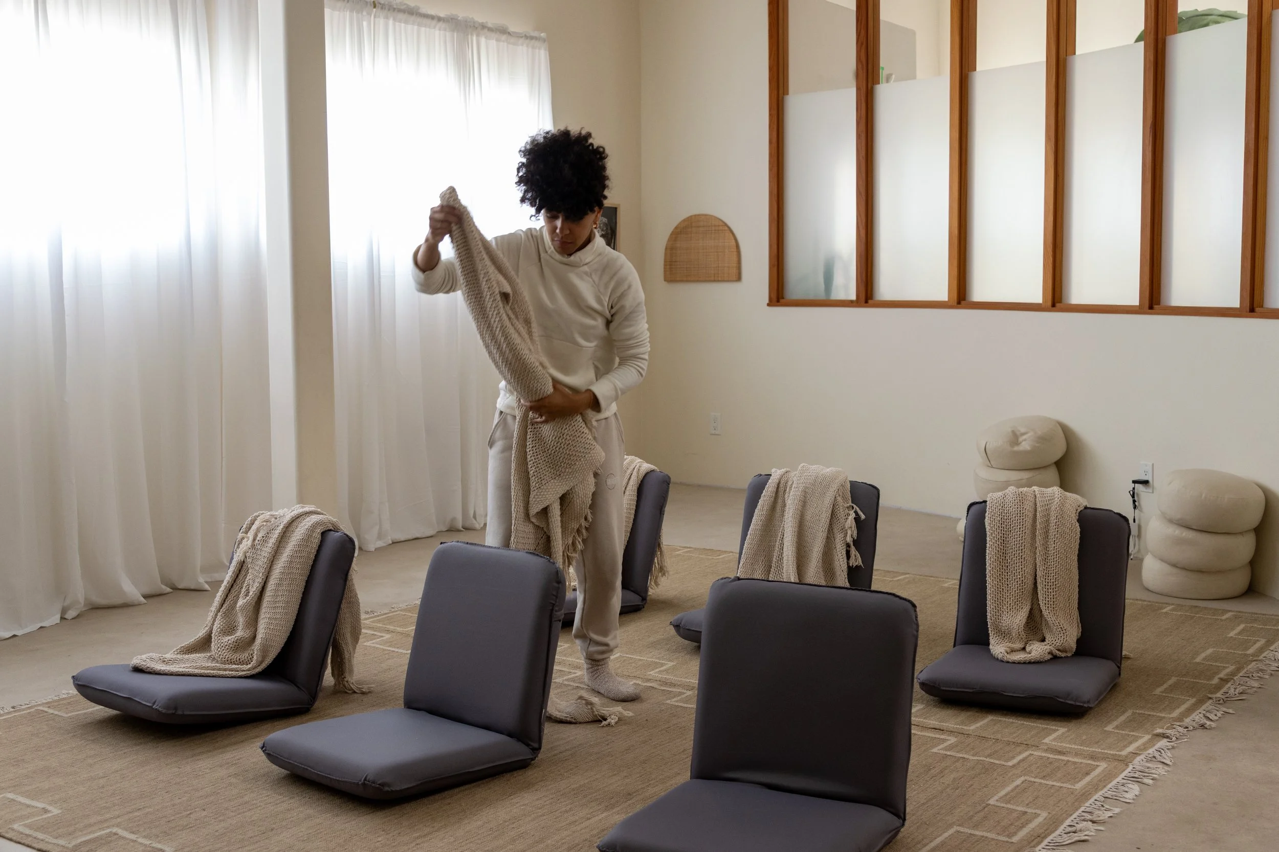 Fully equipped yoga, breathwork, retreats, community circle and sound bath wellness studio venue rental in Los Angeles — seats 15 on mats or 22 on backjacks — Sueños Social Club. latino and black wellness teacher