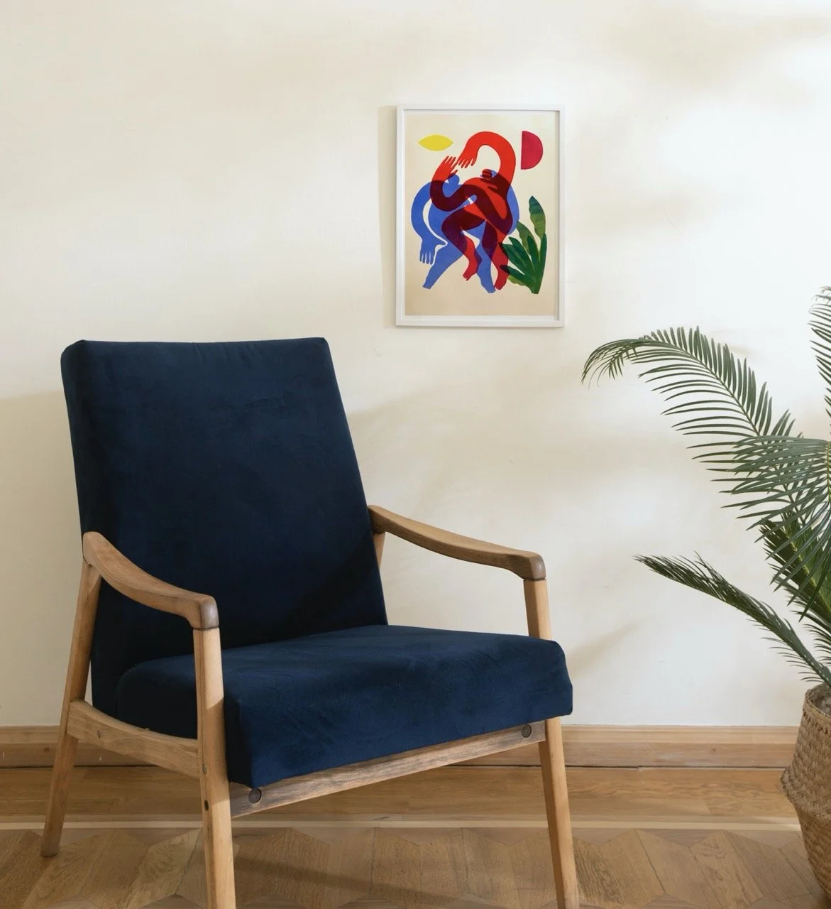 Print shown behind armchair in frame