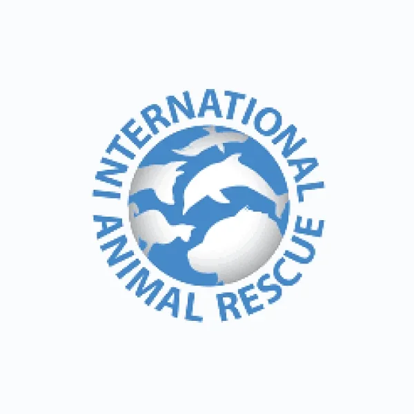 Logo of the International Animal Rescue featuring a globe with dolphins, surrounded by the organization's name.