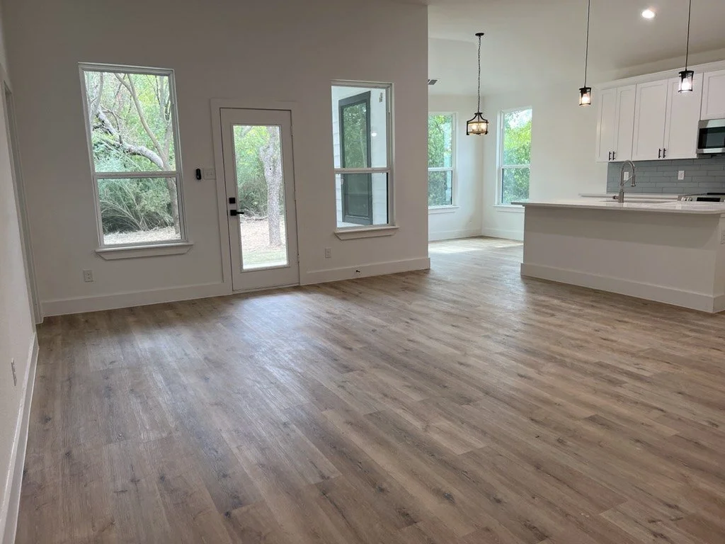 Luxury vinyl plank (LVP) flooring in an open floor plan