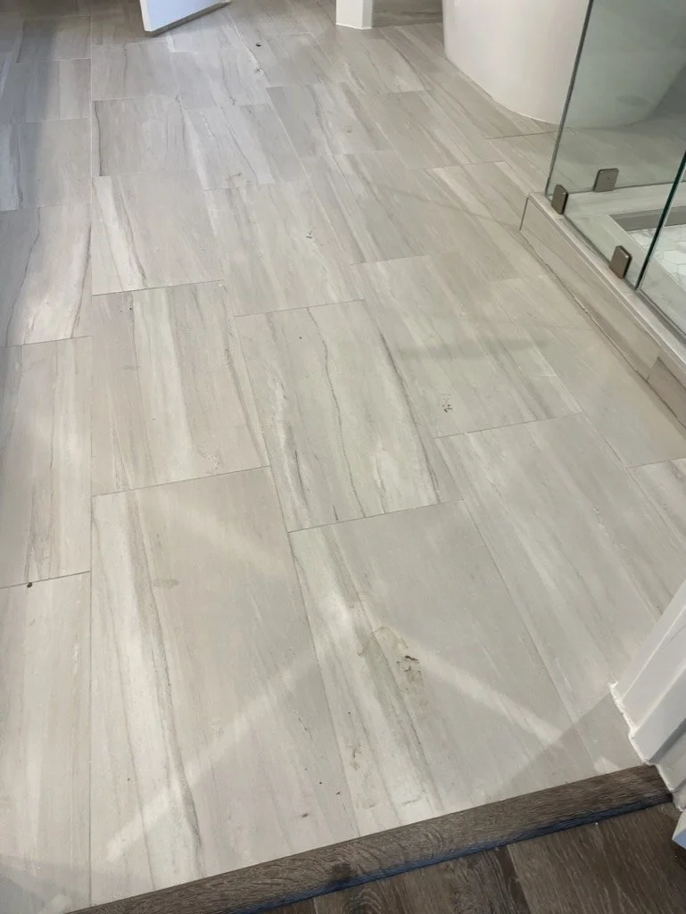 Wood-look porcelain tile floor in a bathroom