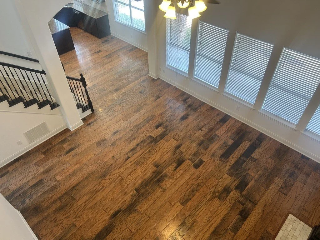 Hand-scraped hardwood floors with staircase