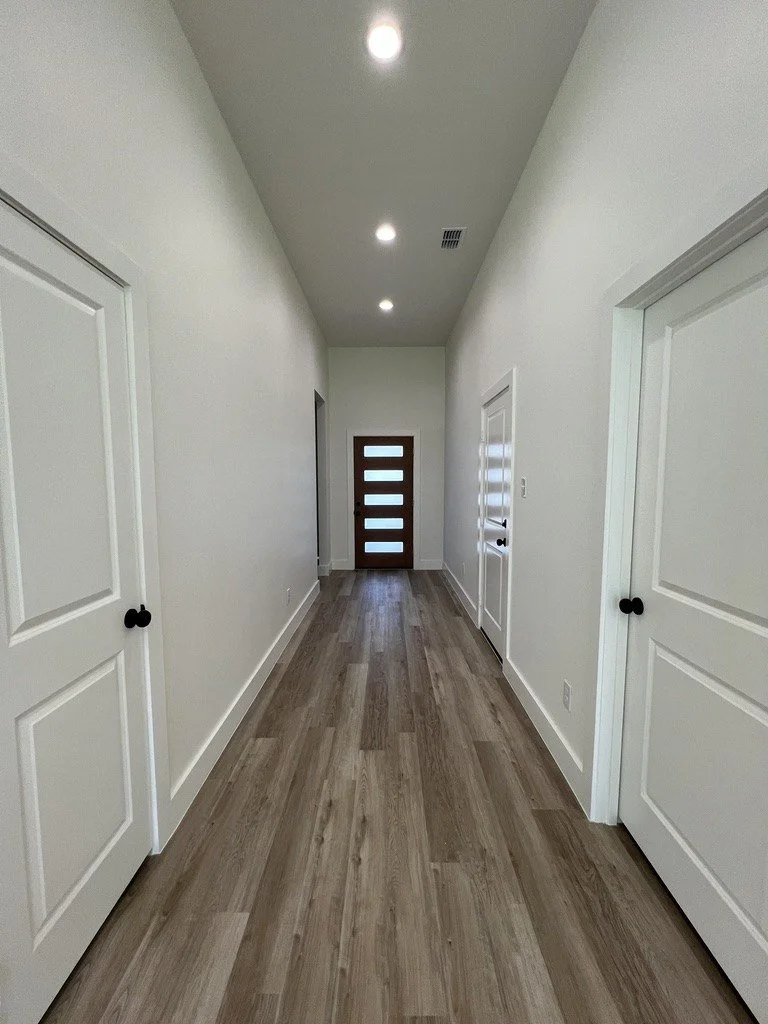 LVP flooring in a new construction hallway