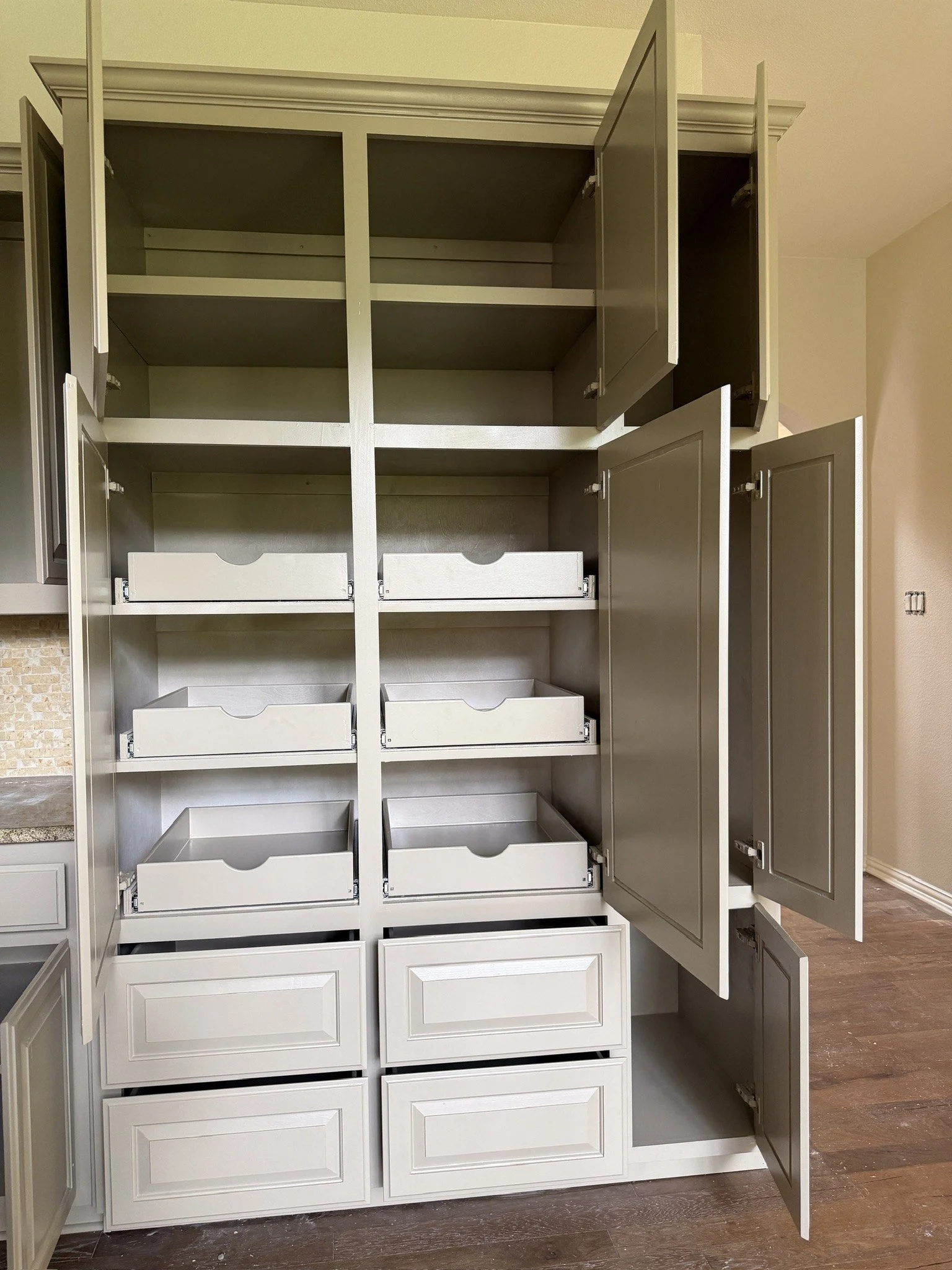 Custom pantry cabinet with pull-out drawers