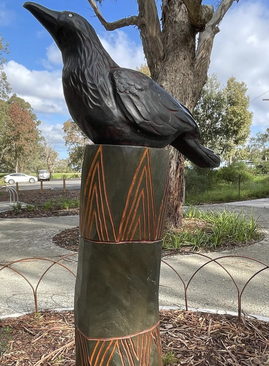 carved-poles-wattle-park-raven-wattleglen.png