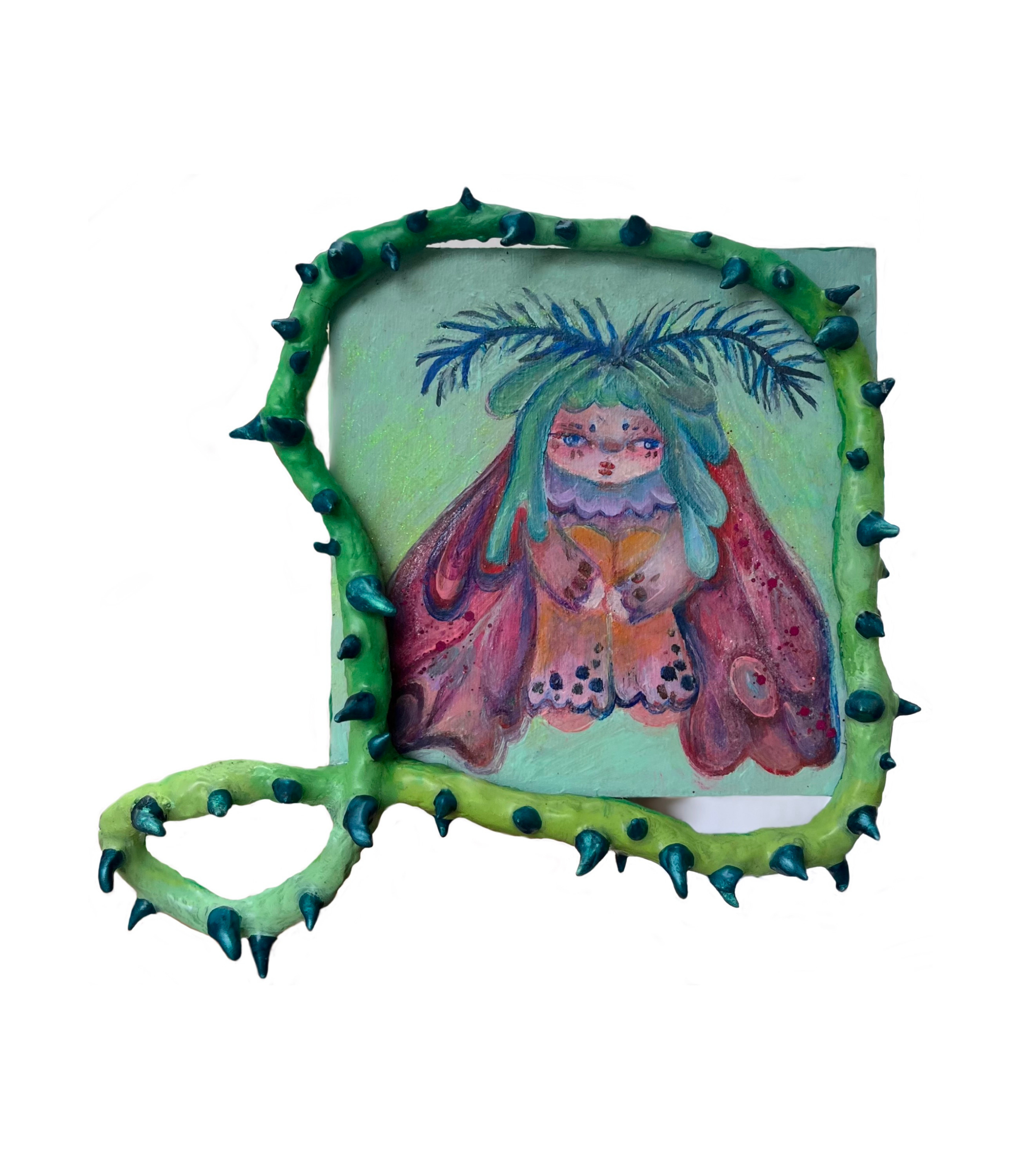 A colorful mixed-media art piece featuring a butterfly with a painted portrait of a woman with green hair and foliage on her head, surrounded by a green, spiked, vine-like frame.
