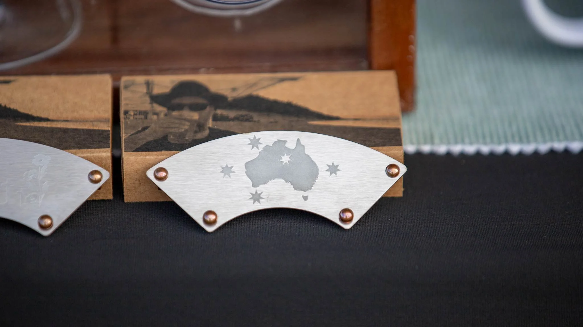 TiMelly Australia southern cross moustache protector resting agains it's box at a market.jpg