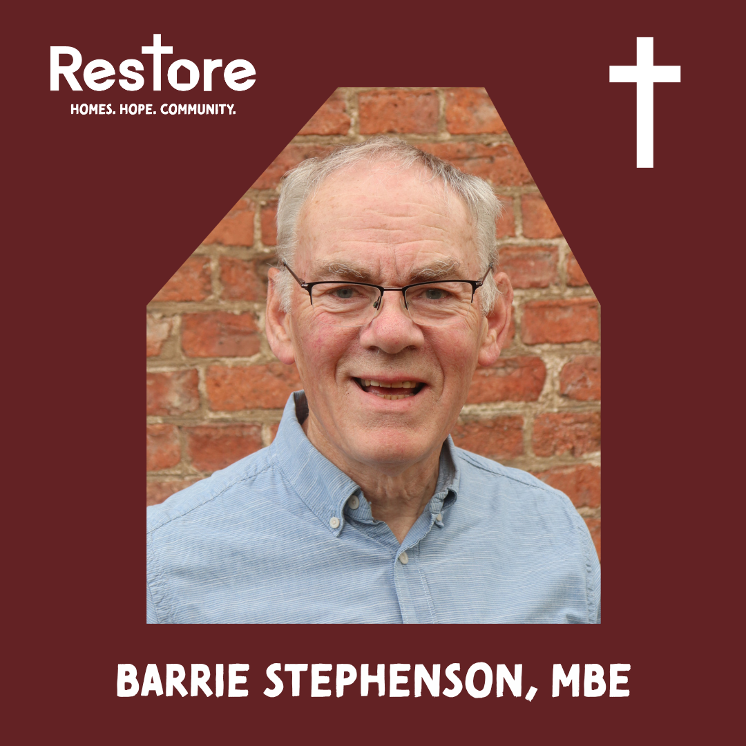 man in blue shirt and glasses, smiling, in front of a red brick wall. Caption reads 'Barrie Stephenson, M.B.E.'