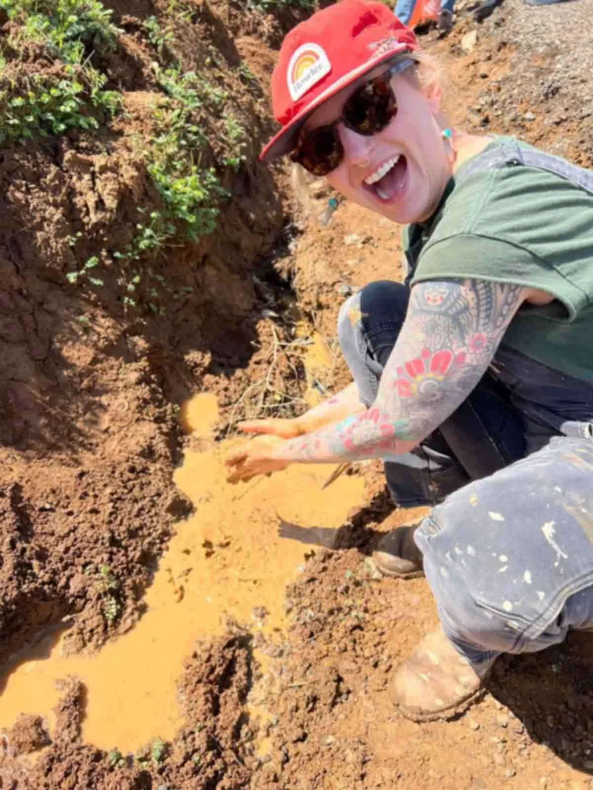 woman-playing-in-mud-puddle.jpg