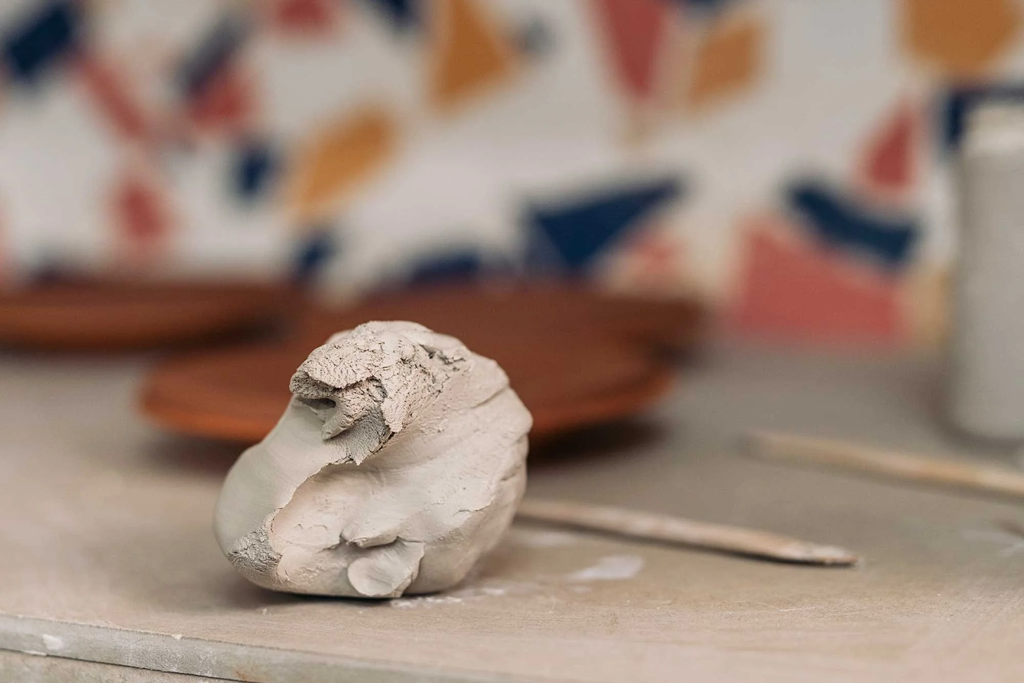 clay-piece-on-table-in-pottery-studio.jpg