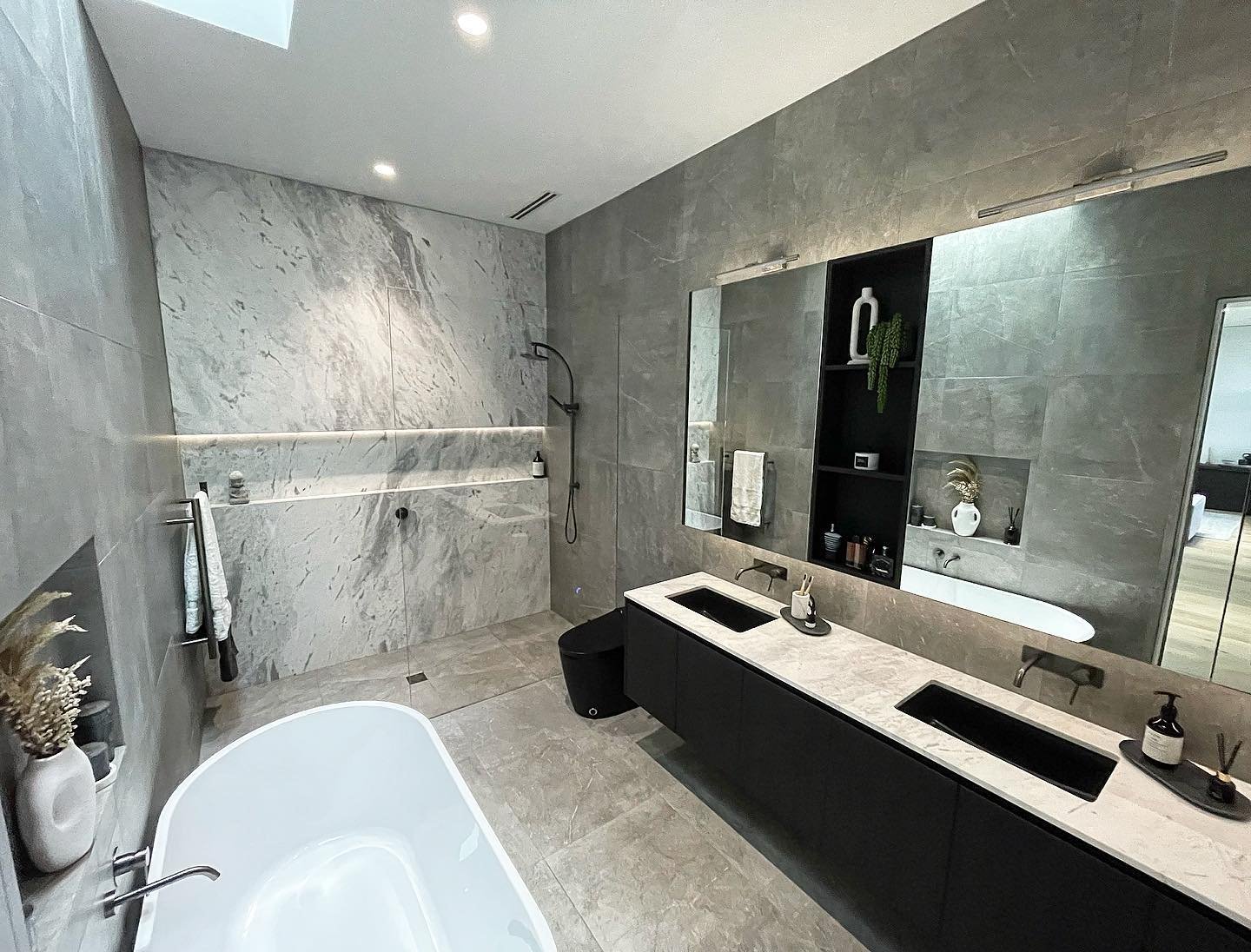 The bathroom of our display suite featuring a stunning marble wall from @skpietra and joinery built to perfection by @element_joinery 
.
.
.
#ibuildnational #newhomes #renovations #extensions #fitouts #builder #building #home #architrcture #work #sit