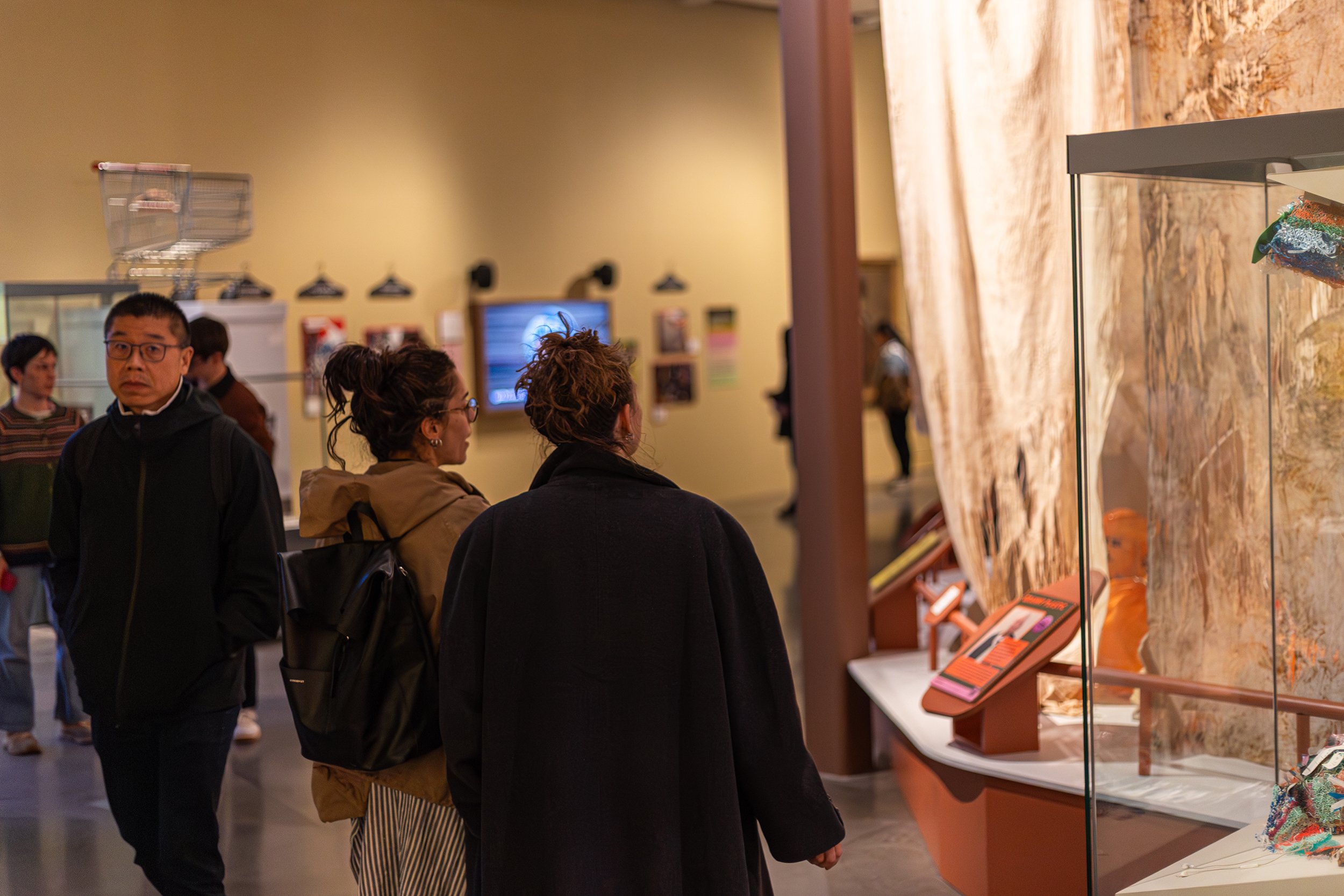 Visitors look at artworks from the Cottonopolis project in Human Natures, Tobias Longmate Manchester Museum.jpg