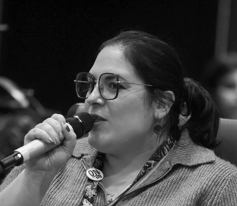 Dr. Nidia Alvarez Armada, Curator of Earth Sciences at Manchester Museum, speaking into a microphone at an event.