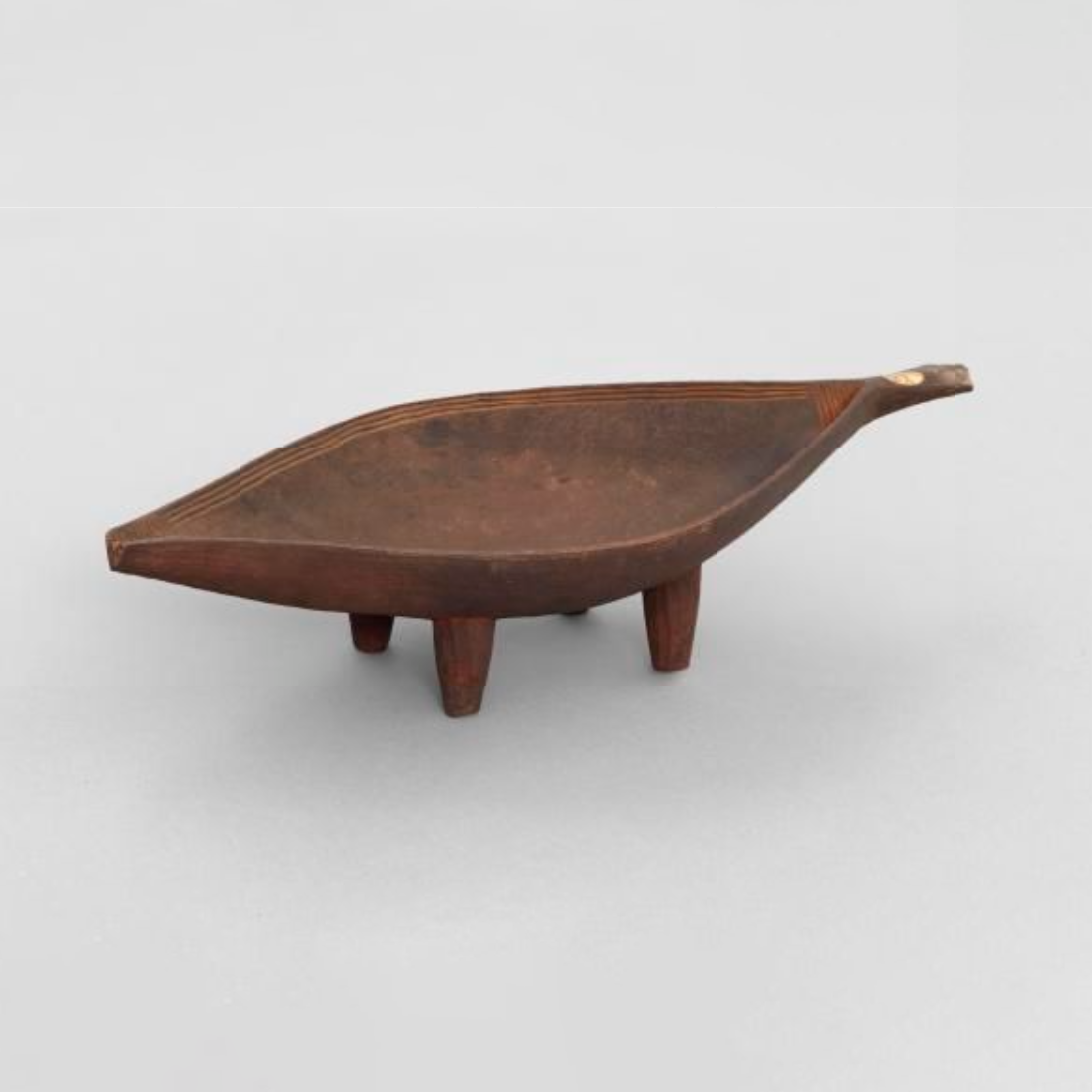 Wooden Dish cut from one block of wood, which is canoe shaped with pointed ends.