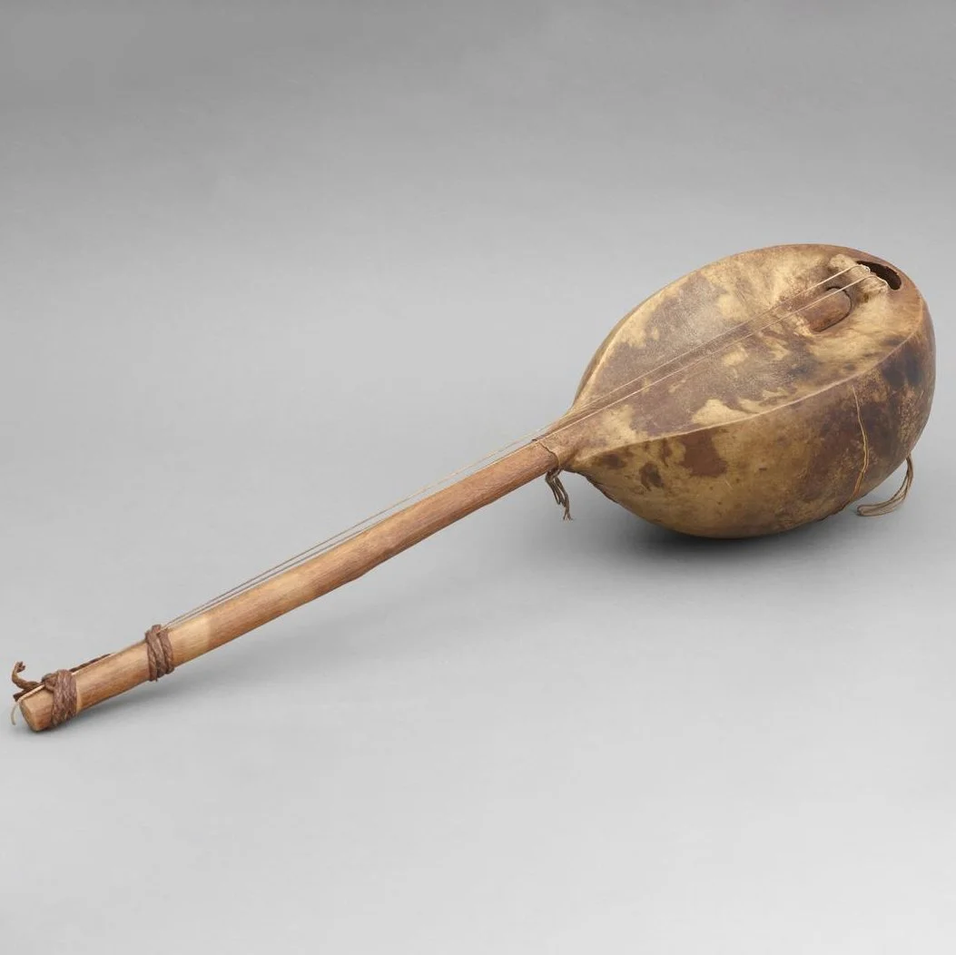 Musical instrument from Africa, featuring a body and long neck with two strings.