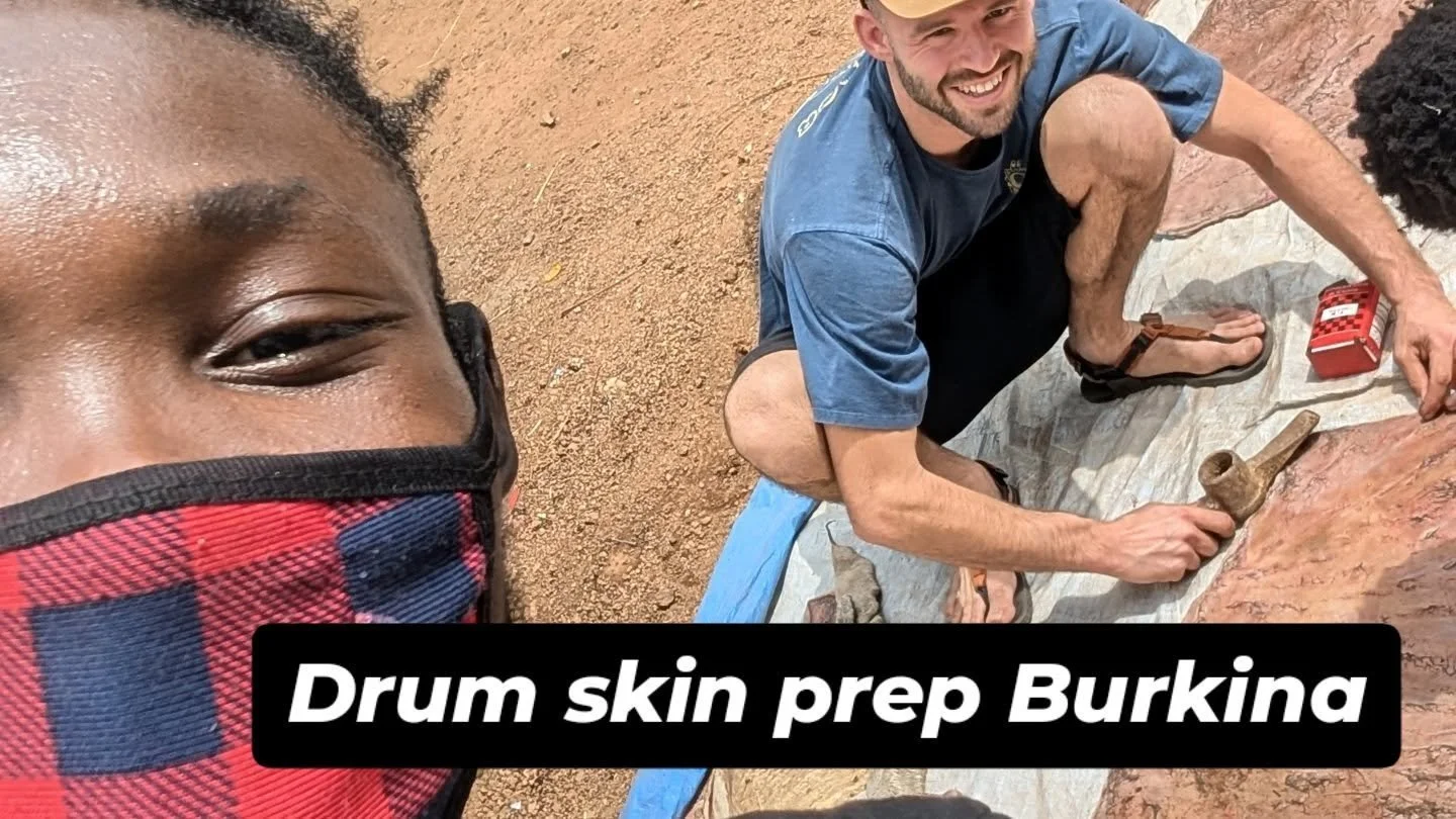 Prepping cow skin for drums in Burkina

1. Buy a fresh cowskin 
2. Wash it thoroughly
3. Cut it into suitable sized pieces
4. Nail it to the ground and let it dry