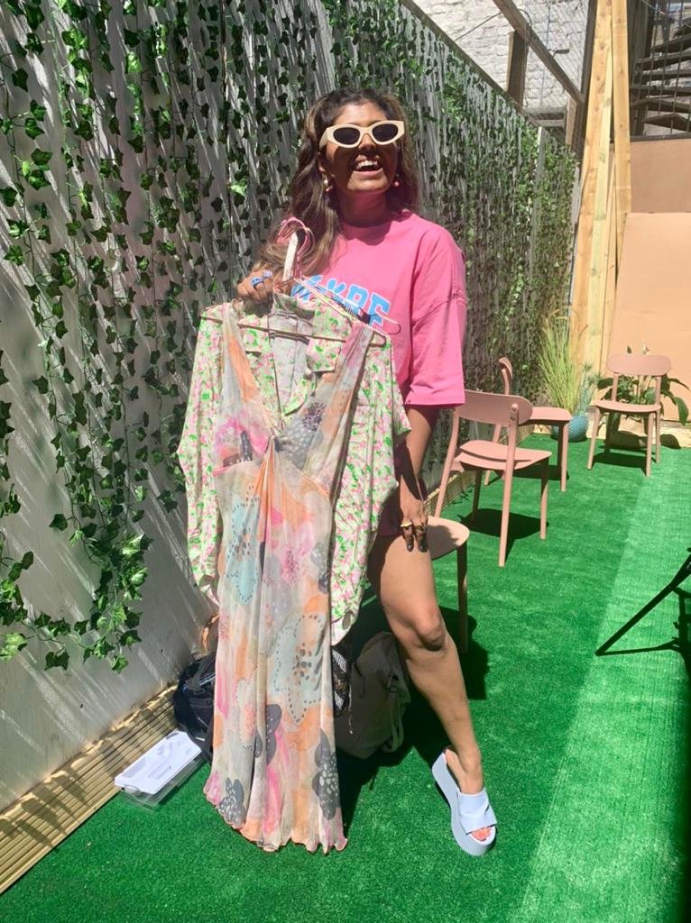 woman holding secondhand dress