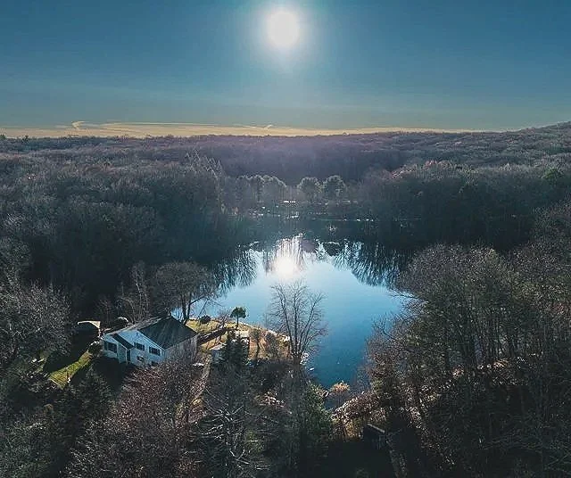drone real estate photo of house overlooking a lake
