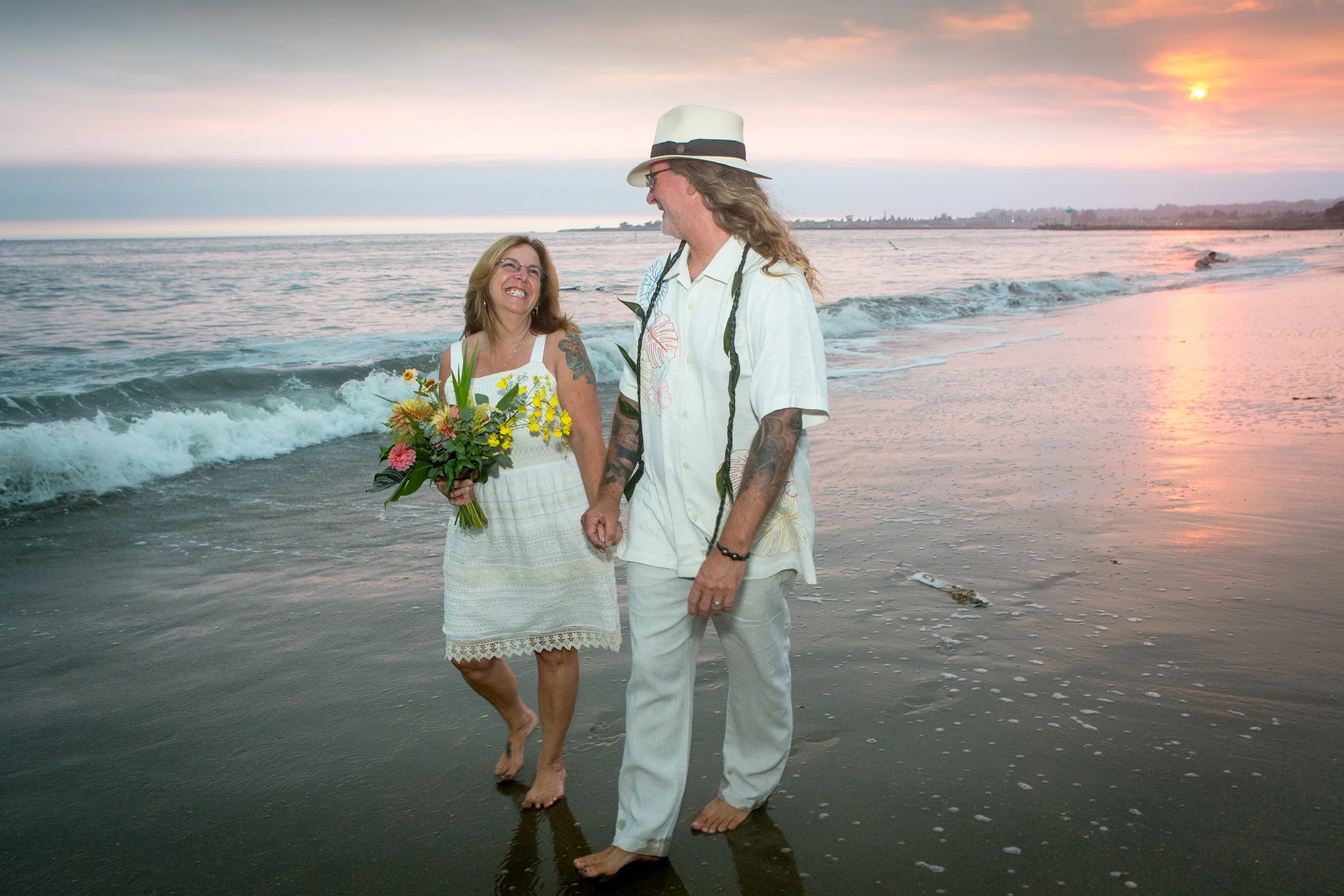 Couple walking on the Beach in Santa Cruz for a romantic elopement