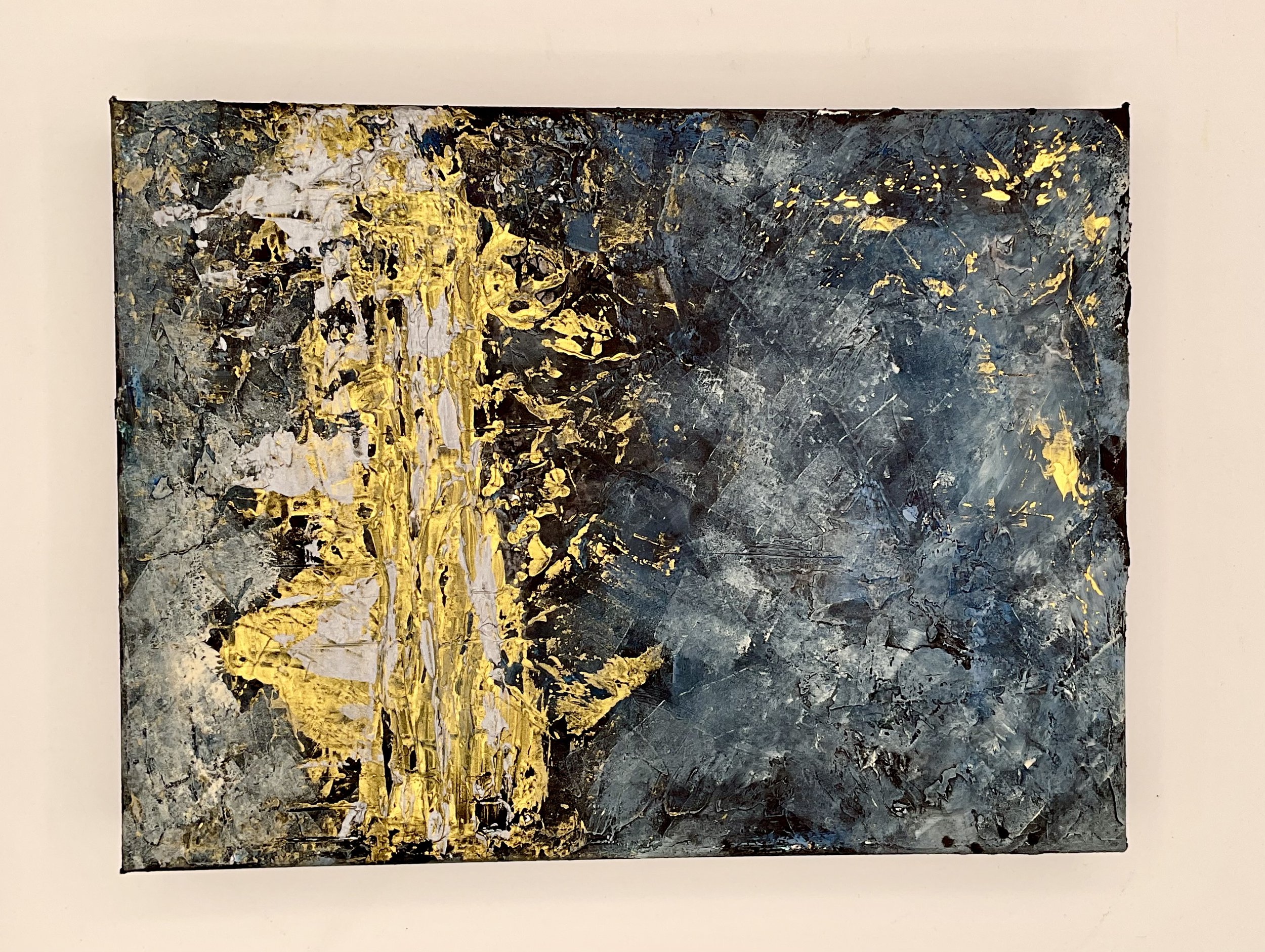 This deep blue textured piece depicts a shock of gold as if lighting within a night sky or ocean scene