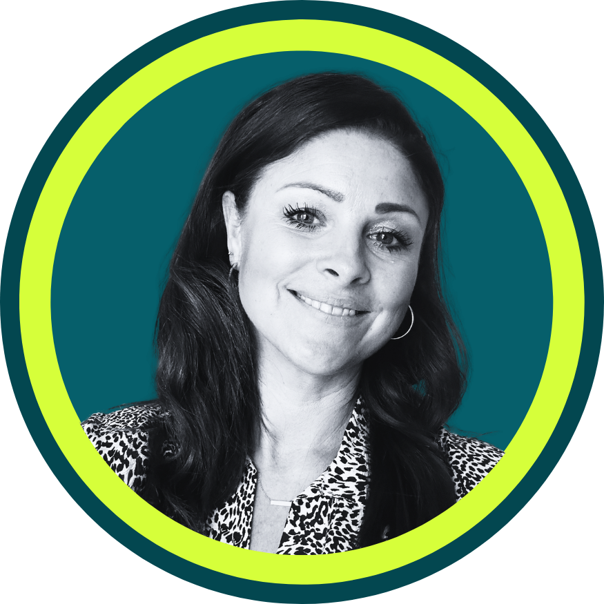 Black and white portrait of a woman with long dark hair smiling, wearing a leopard print top and hoop earrings, inside a yellow circle on a teal background.