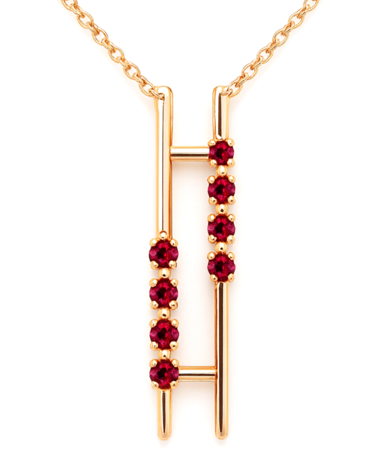 Gold necklace with a pendant featuring a vertical bar design adorned with red gemstones.
