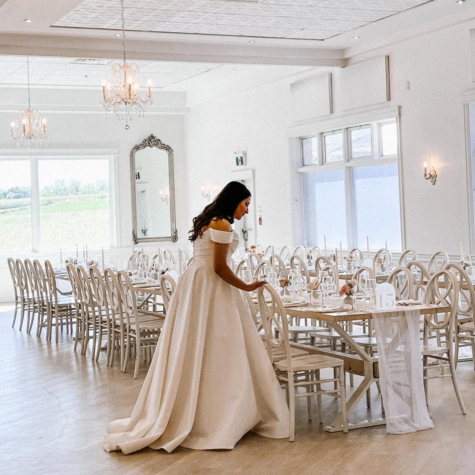 You take a quiet moment before the day officially begins.

You slip away for just a few minutes to see it all together; the stationery, the flowers, the little details you had imagined for months.

Soon the music will start, the room will fill, and e