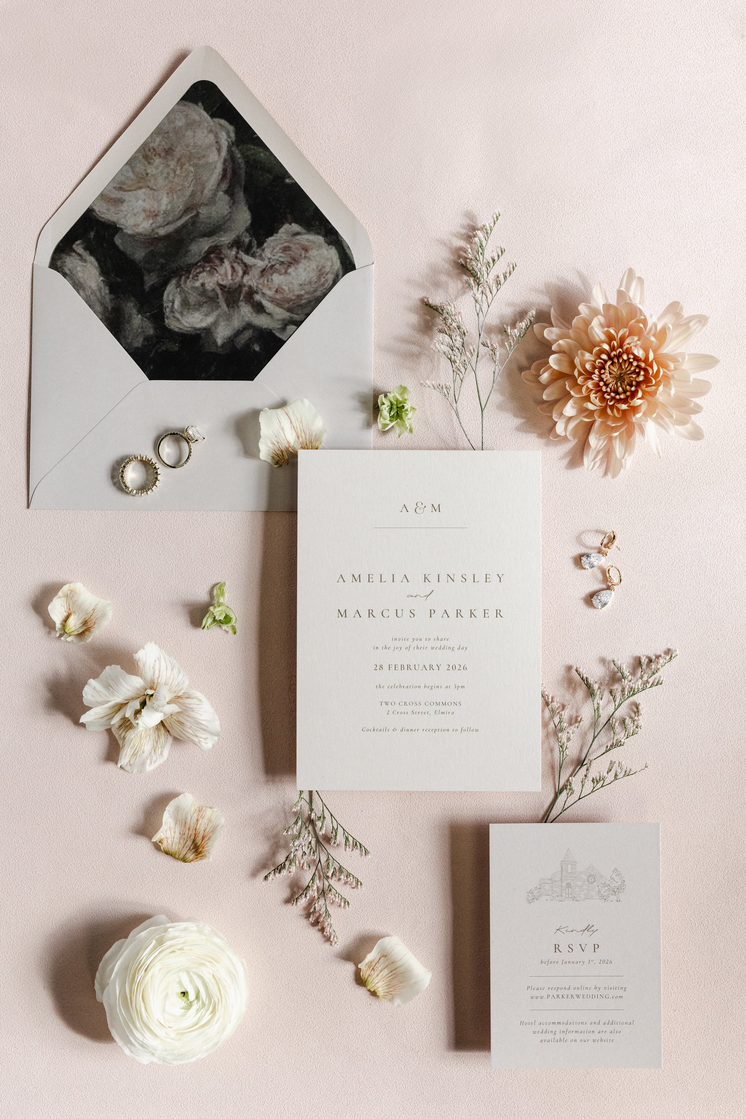 neutral wedding invitation with black floral envelope liner