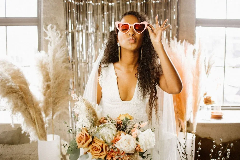 Bride with heart glasses and a boho bouquet