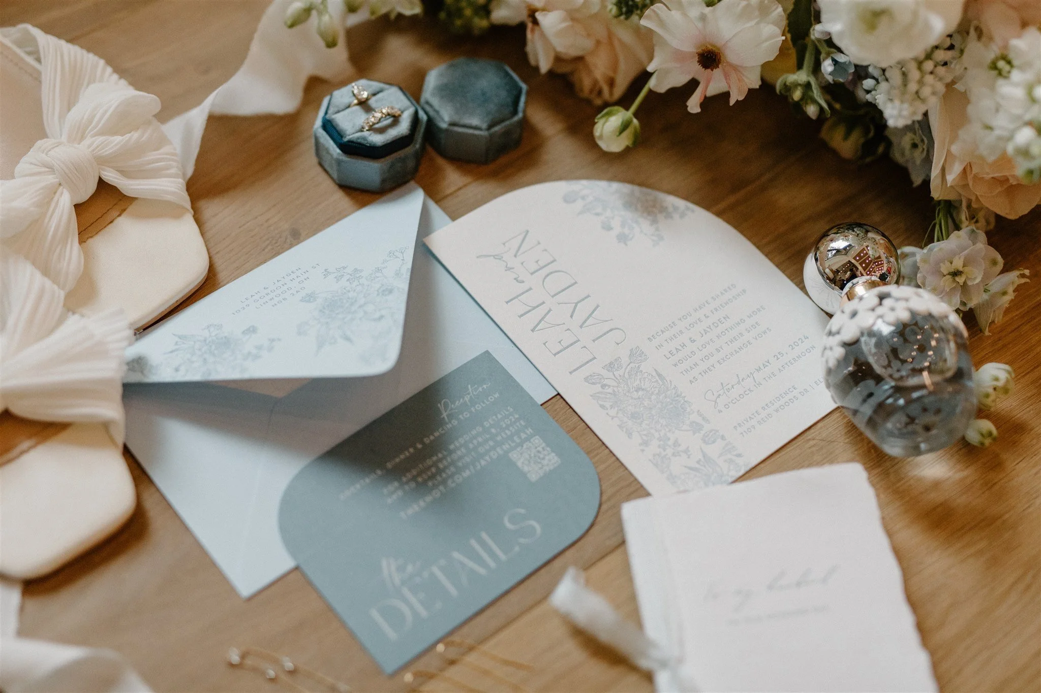 A light blue modern wedding invitation