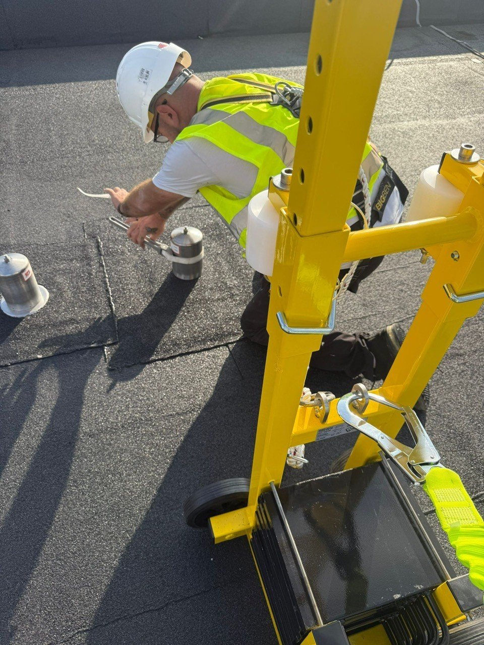 Fall arrest system installation on commercial rooftop