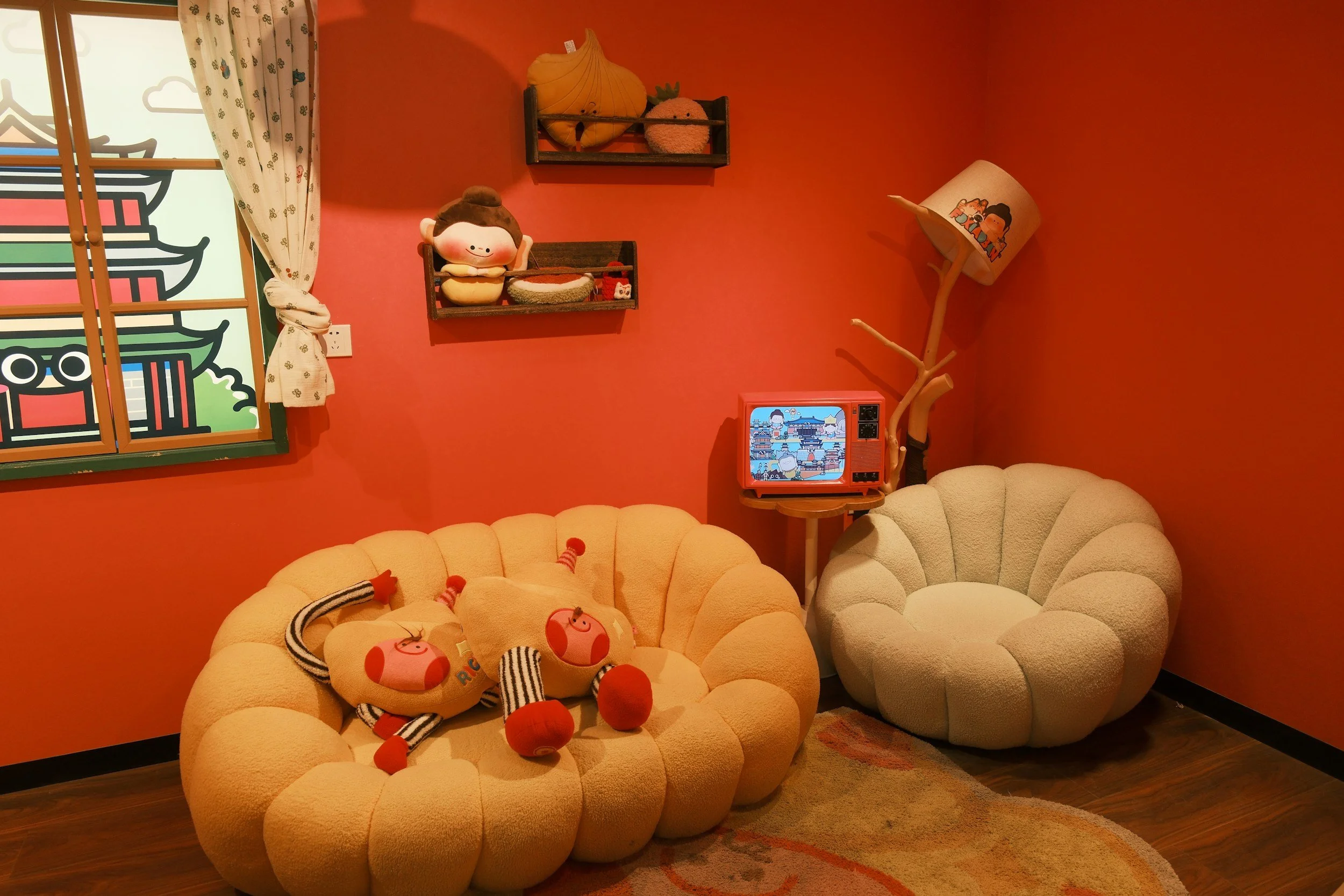 Organized playroom seating area with children’s chairs, wall shelves, and neatly arranged decor in a St. Louis family home