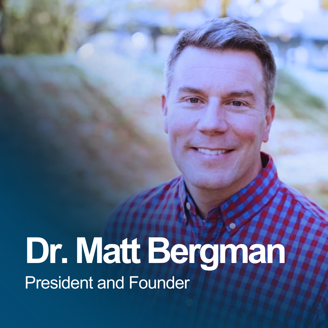 Portrait of Dr. Matt Bergman, President and Founder, smiling outdoors with blurred background.